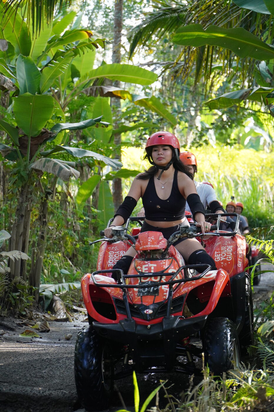 Riding an ATV through a jungle trail
